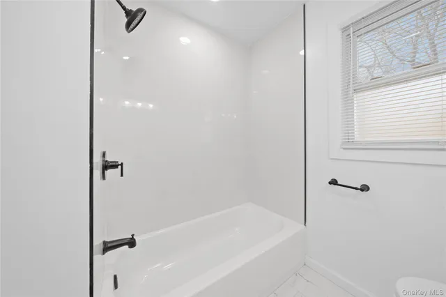 a bathroom with a bathtub