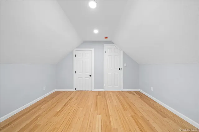 a view of room with wooden floor