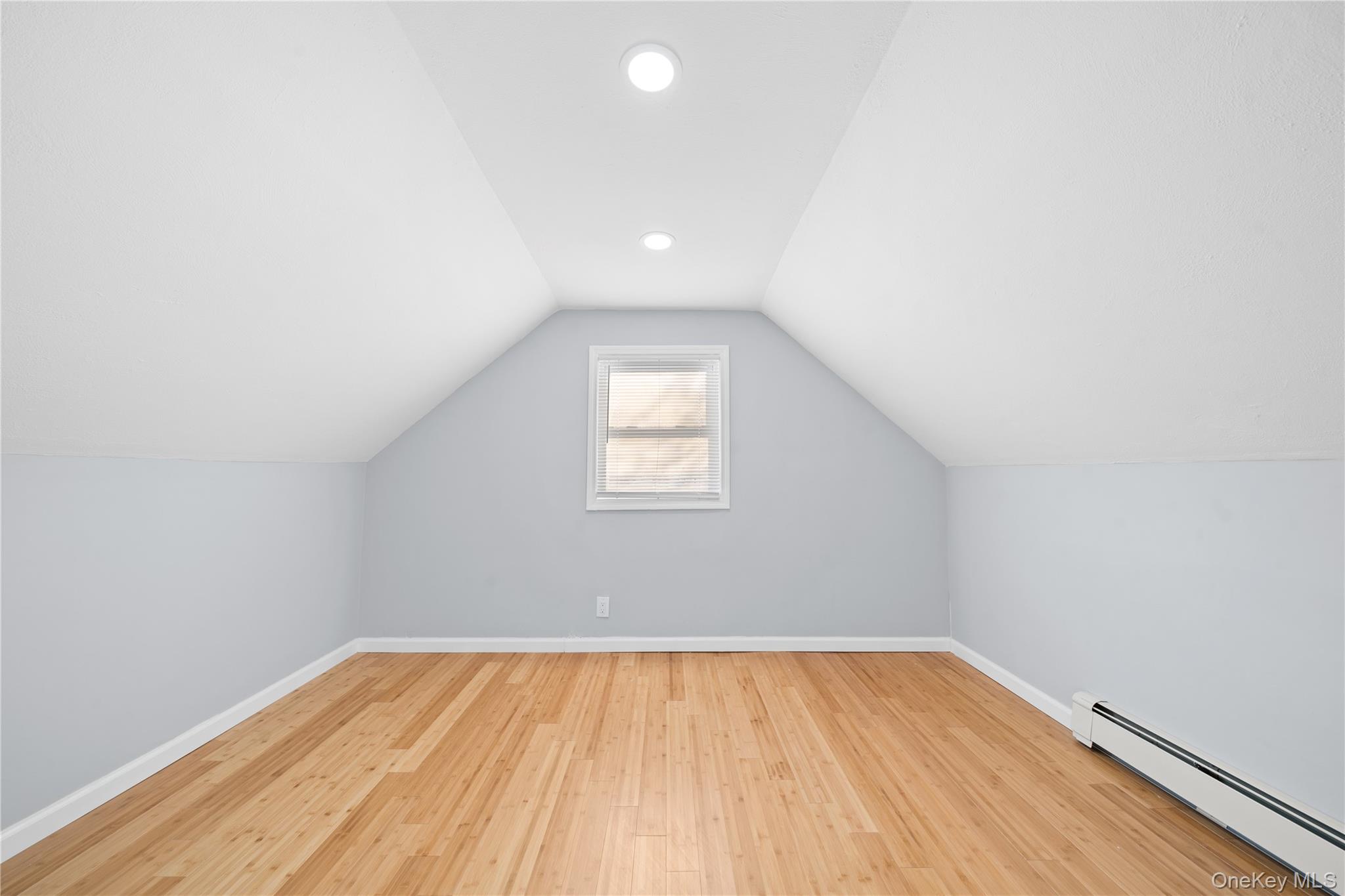193 North Arizona Road West Babylon, NY 11704 - Photo 22 of 37 an empty room with wooden floor and windows