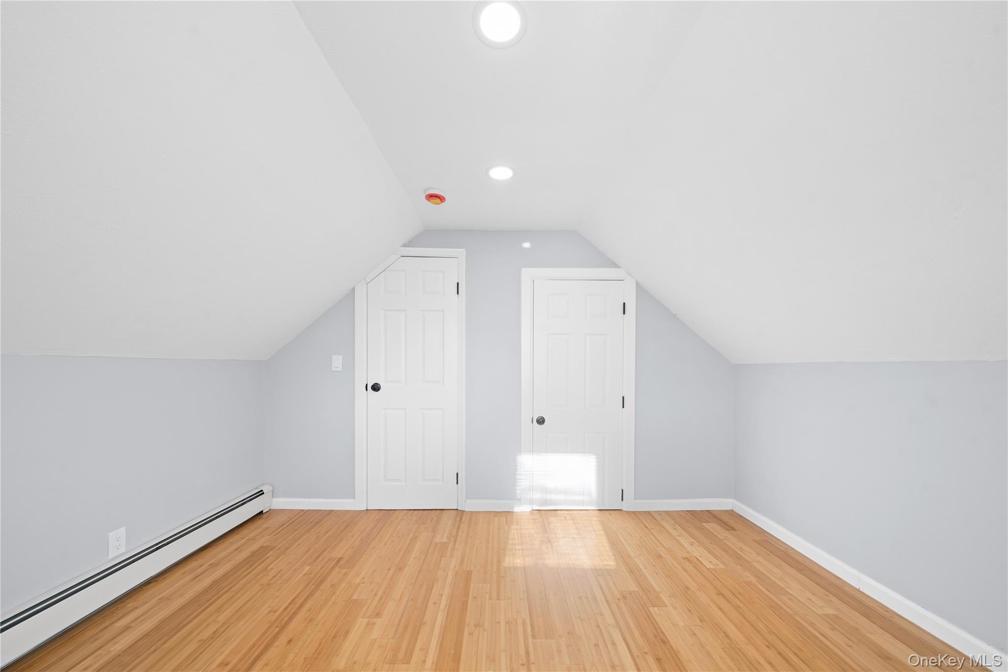 193 North Arizona Road West Babylon, NY 11704 - Photo 23 of 37 a view of an empty room with wooden floor and a window