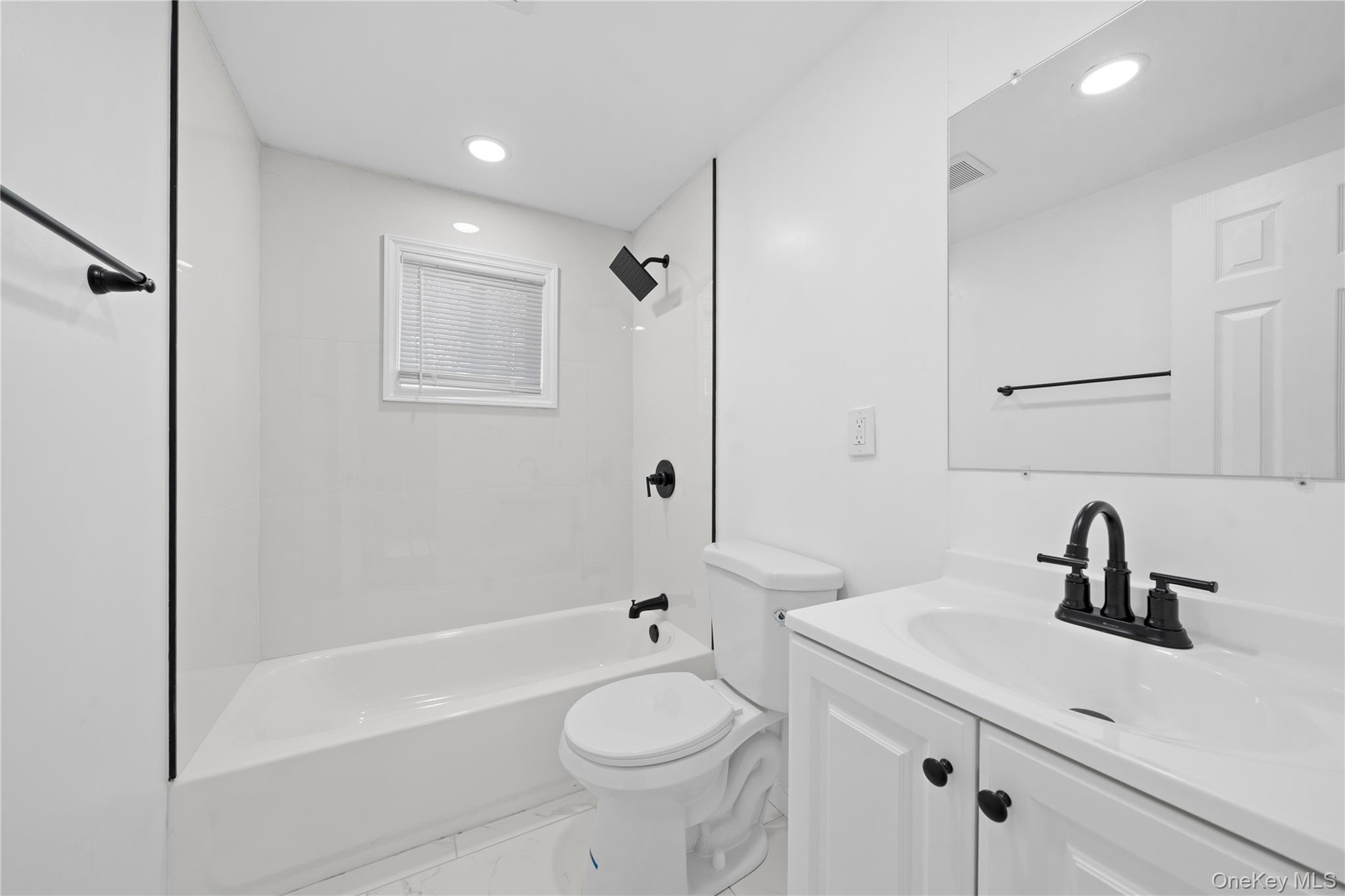 193 North Arizona Road West Babylon, NY 11704 - Photo 24 of 37 a bathroom with a sink a toilet and shower