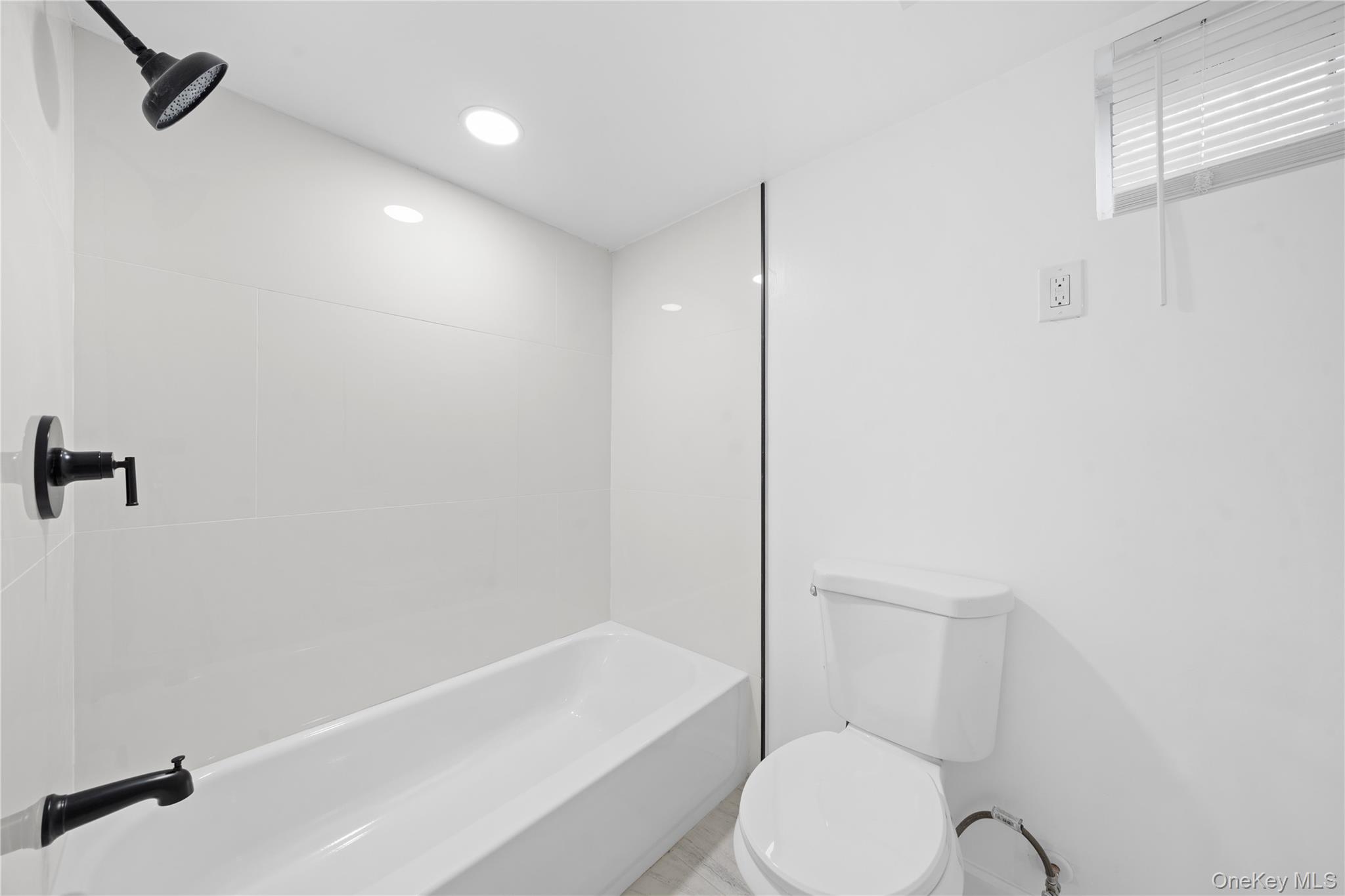 193 North Arizona Road West Babylon, NY 11704 - Photo 30 of 37 a white toilet sitting next to a bath tub