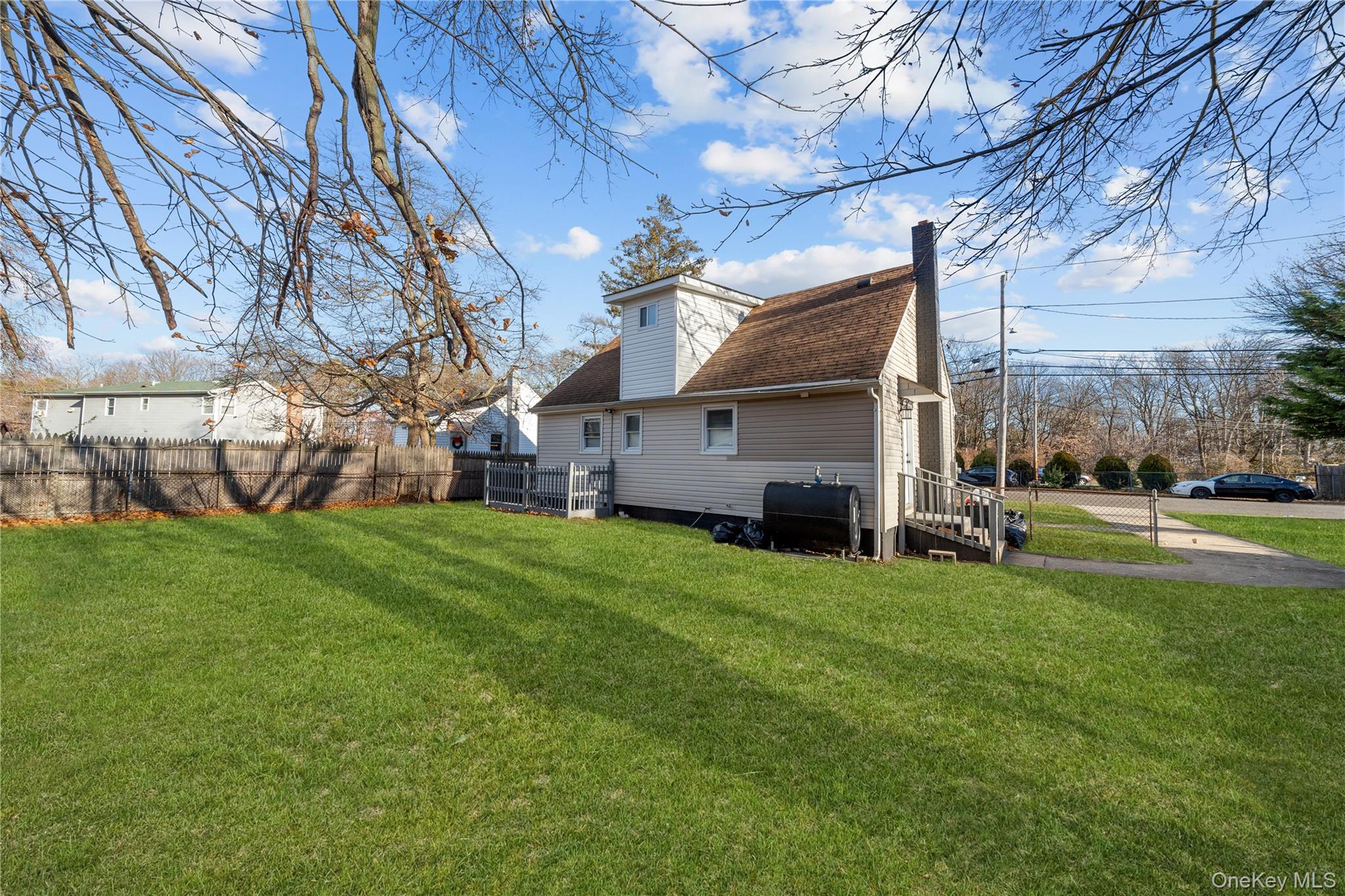 193 North Arizona Road West Babylon, NY 11704 - Photo 35 of 37 a view of a house with a big yard and large trees