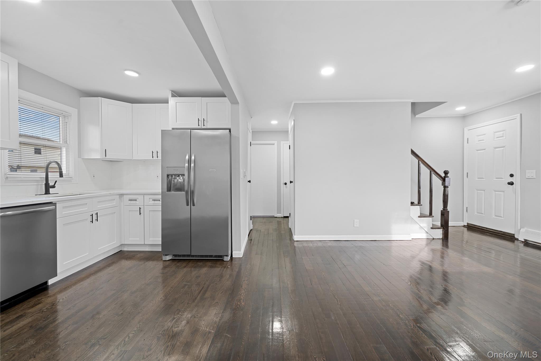 193 North Arizona Road West Babylon, NY 11704 - Photo 5 of 37 a view of a kitchen with wooden floor and electronic appliances