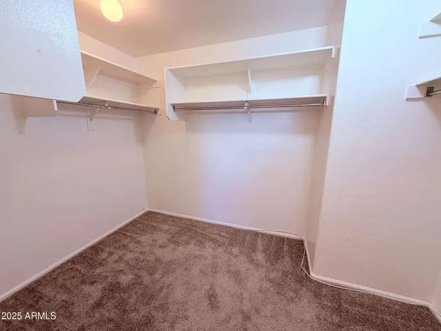 a bathroom with a double vanity sink toilet and a mirror
