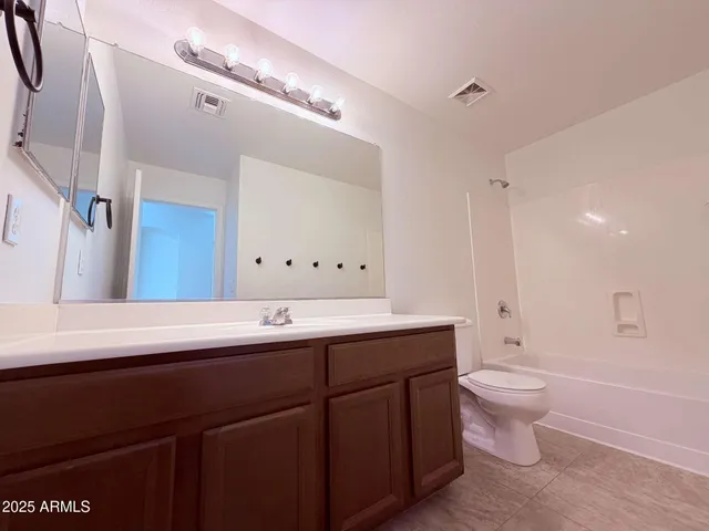 a view of house with backyard