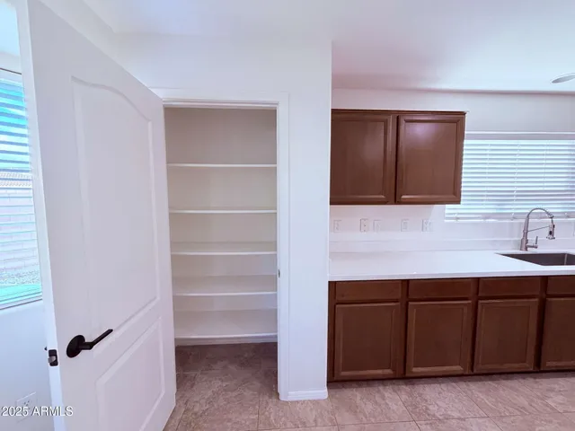 a view of an empty room with stairs