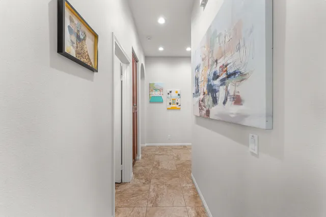 a living room with a bed and a window