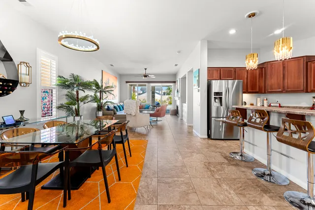 a dining room table with chairs and a table