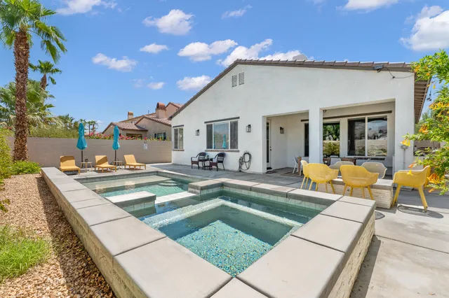 a view of a pathway with potted plants