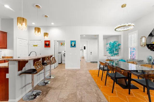 a dining room with furniture and window