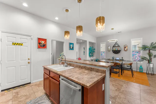 a living room with furniture a flat screen tv and a large window
