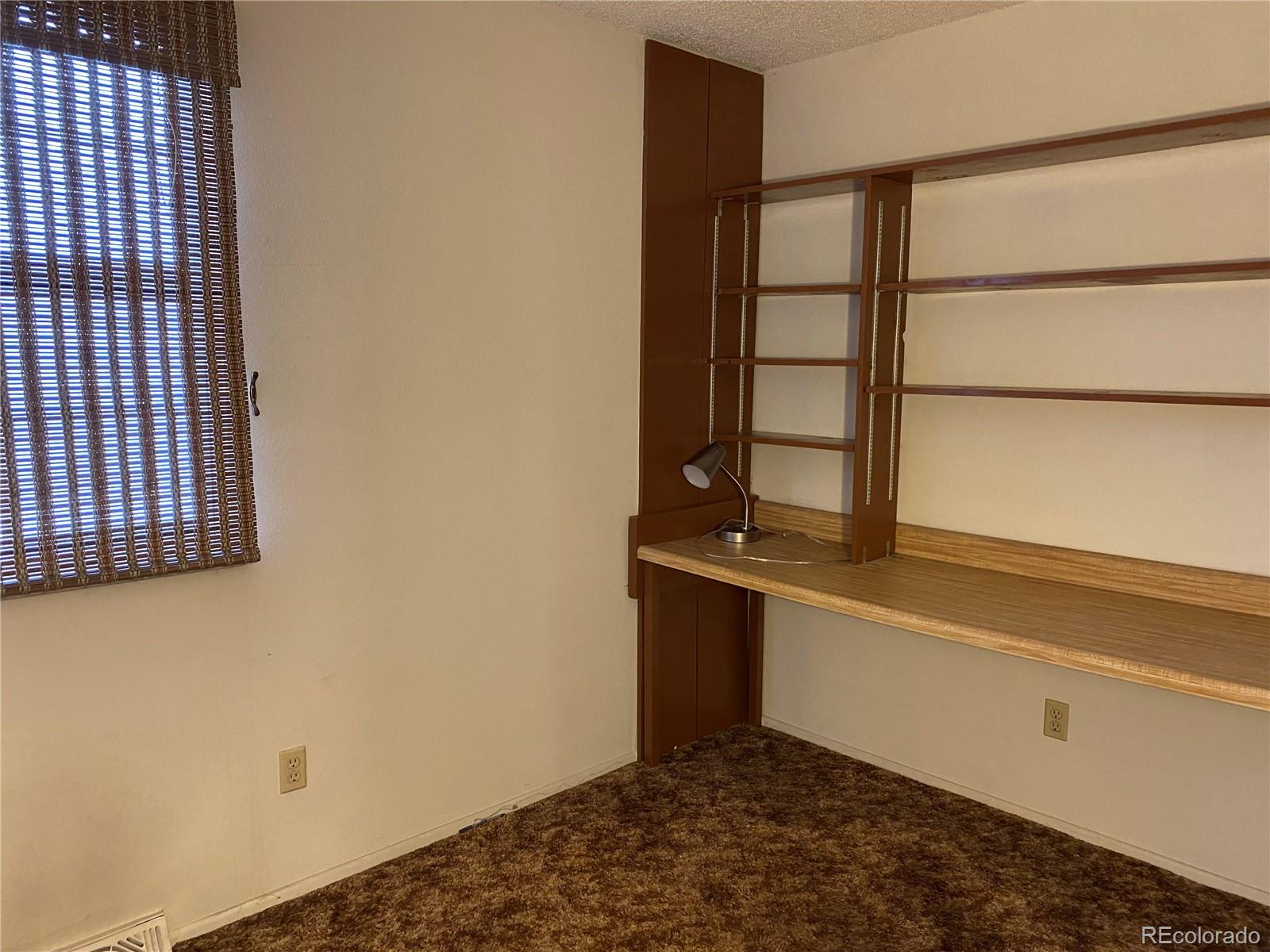 1165 Alter Way Broomfield, CO 80020 - Photo 12 of 31 a view of an empty room with a window
