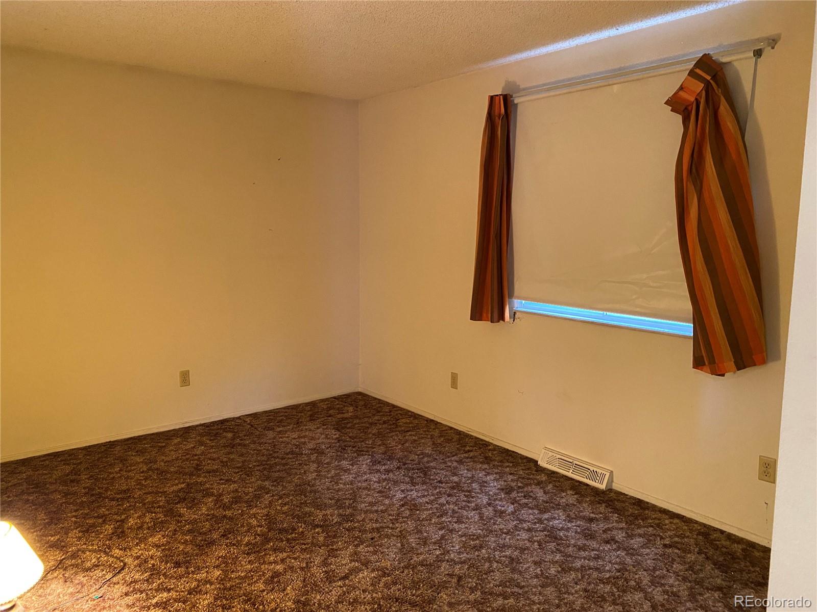 1165 Alter Way Broomfield, CO 80020 - Photo 14 of 31 a view of small space with wooden floor and a window