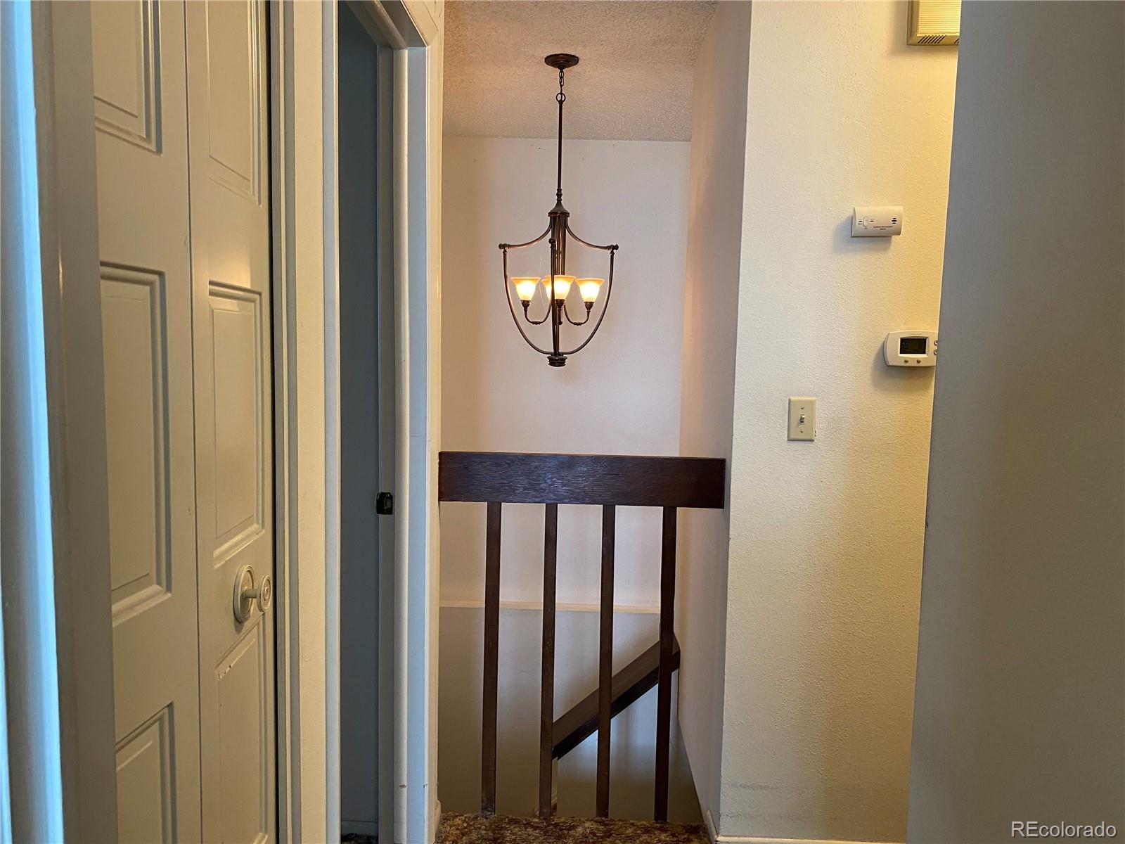 1165 Alter Way Broomfield, CO 80020 - Photo 18 of 31 a view of a hallway with windows