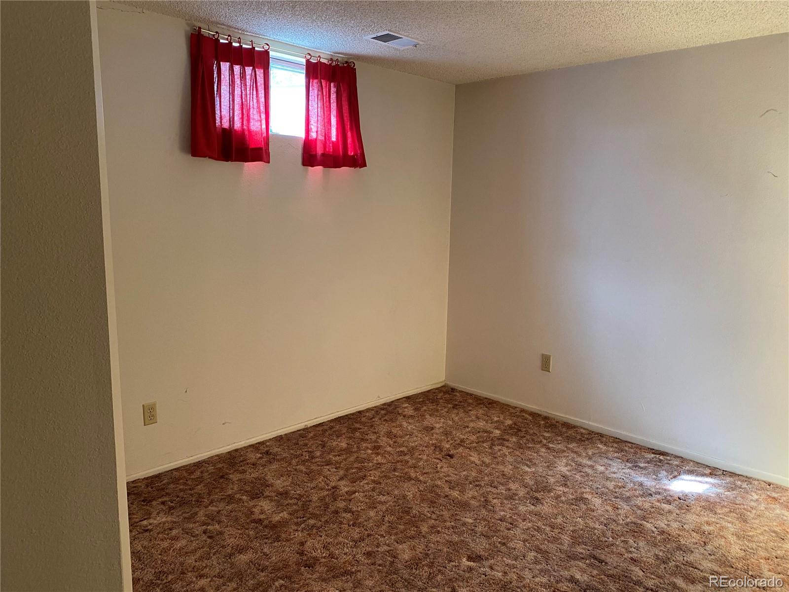 1165 Alter Way Broomfield, CO 80020 - Photo 22 of 31 an empty room with windows and closet