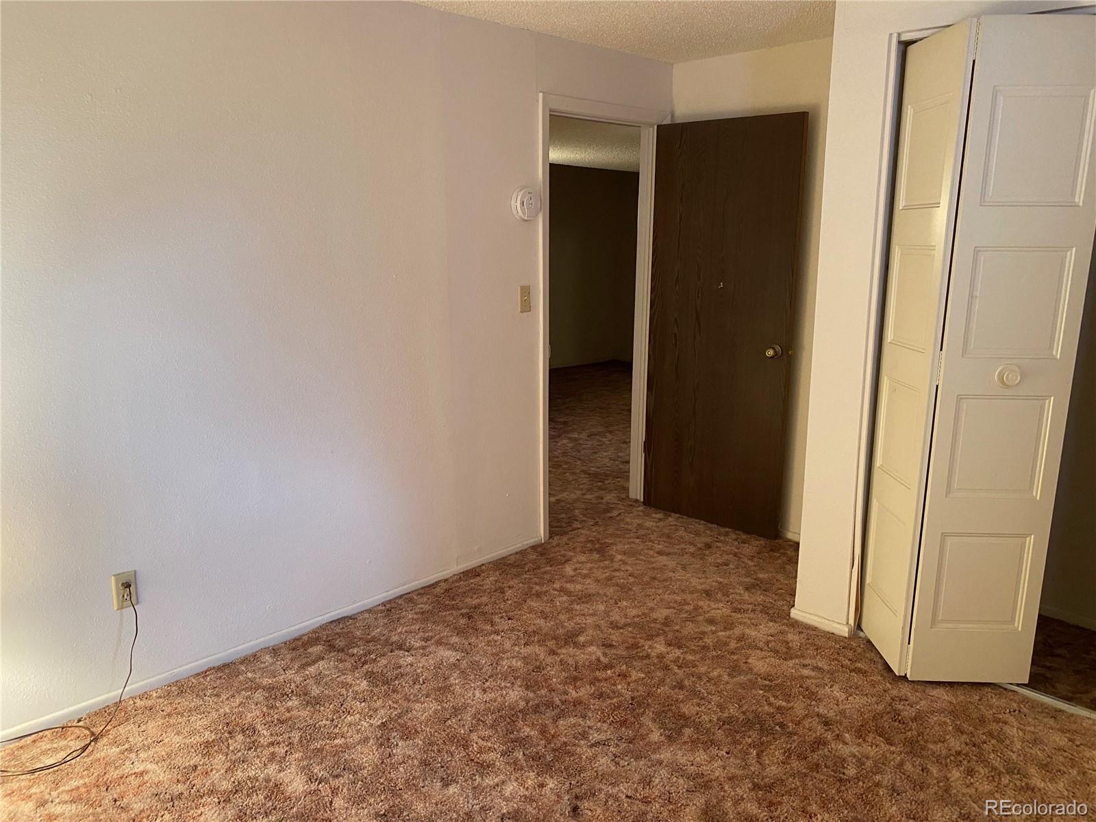 1165 Alter Way Broomfield, CO 80020 - Photo 23 of 31 an empty room with entrance door