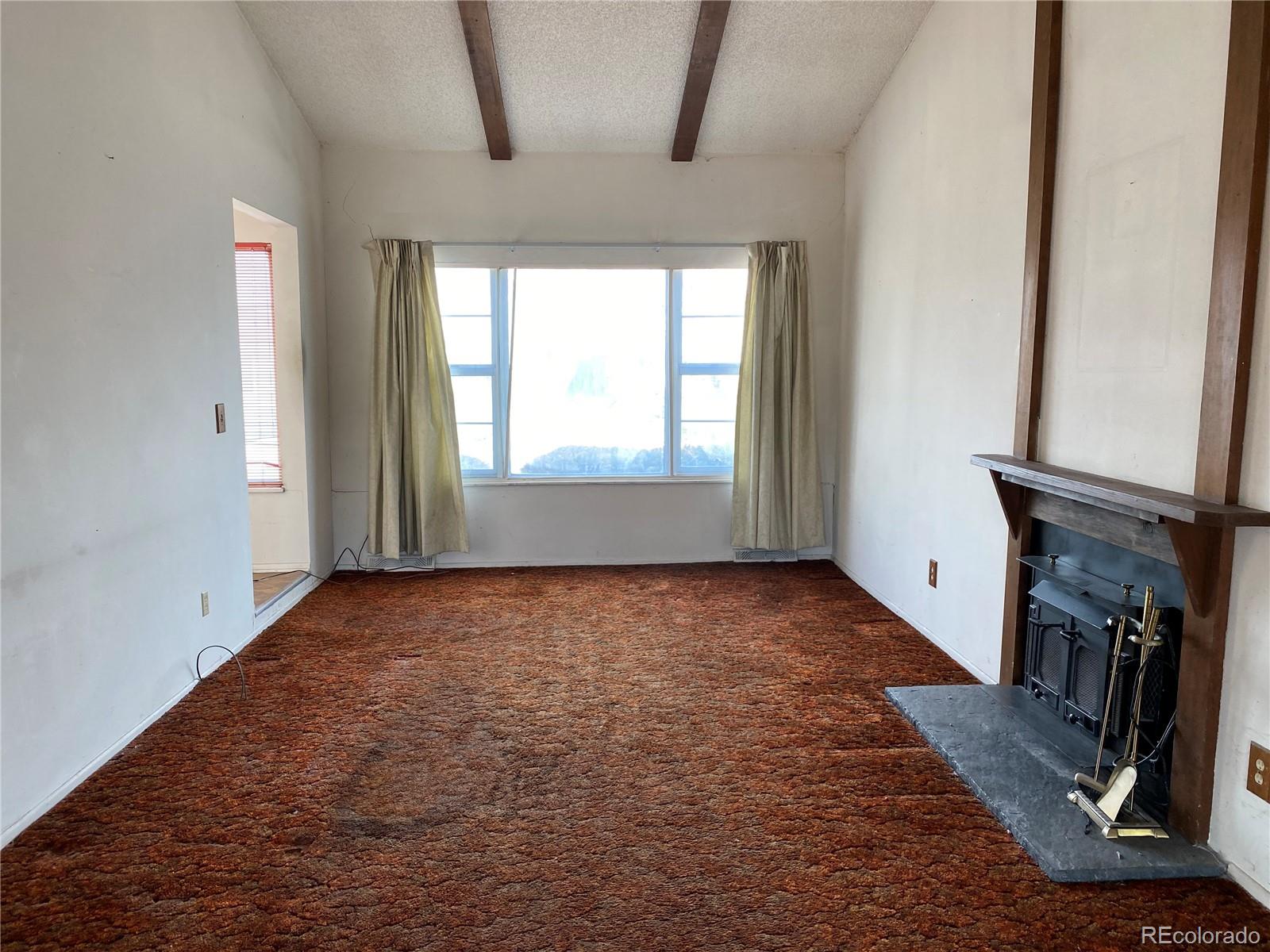 1165 Alter Way Broomfield, CO 80020 - Photo 3 of 31 a view of an empty room with staircase and mirror