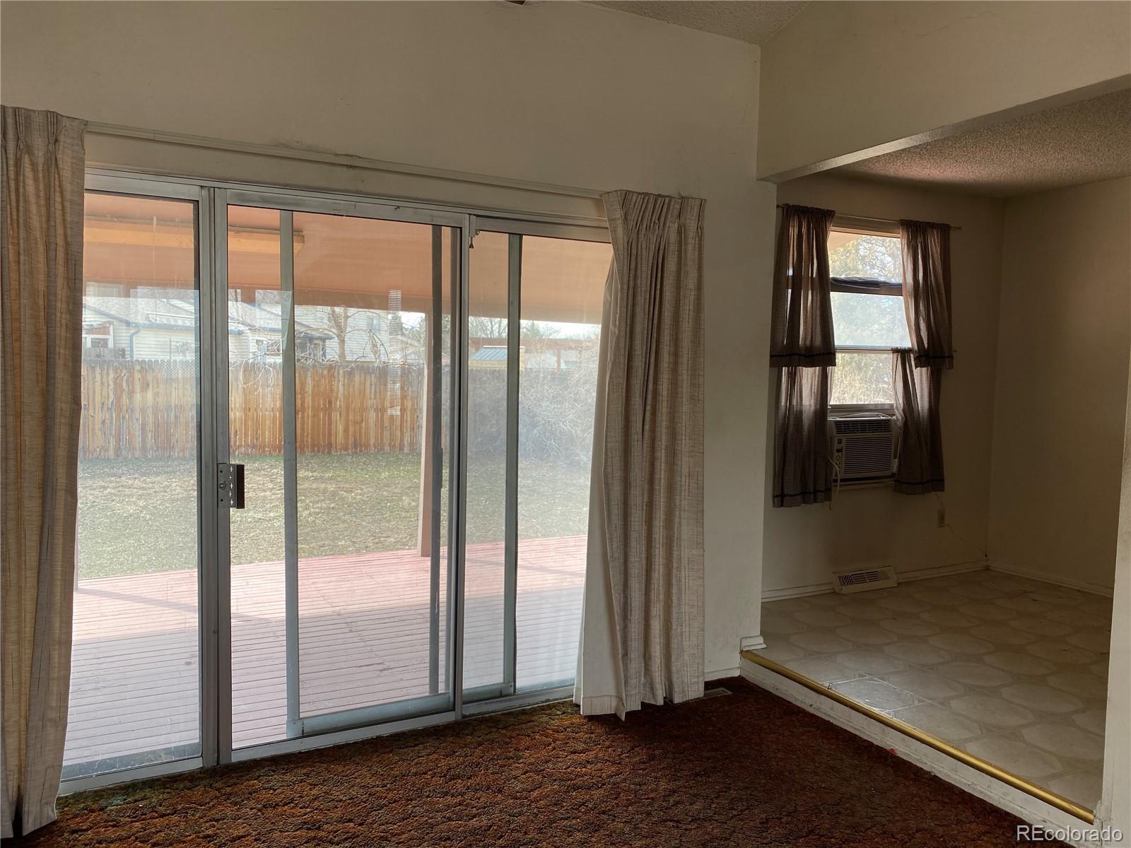 1165 Alter Way Broomfield, CO 80020 - Photo 4 of 31 a view of empty room with wooden floor and fan