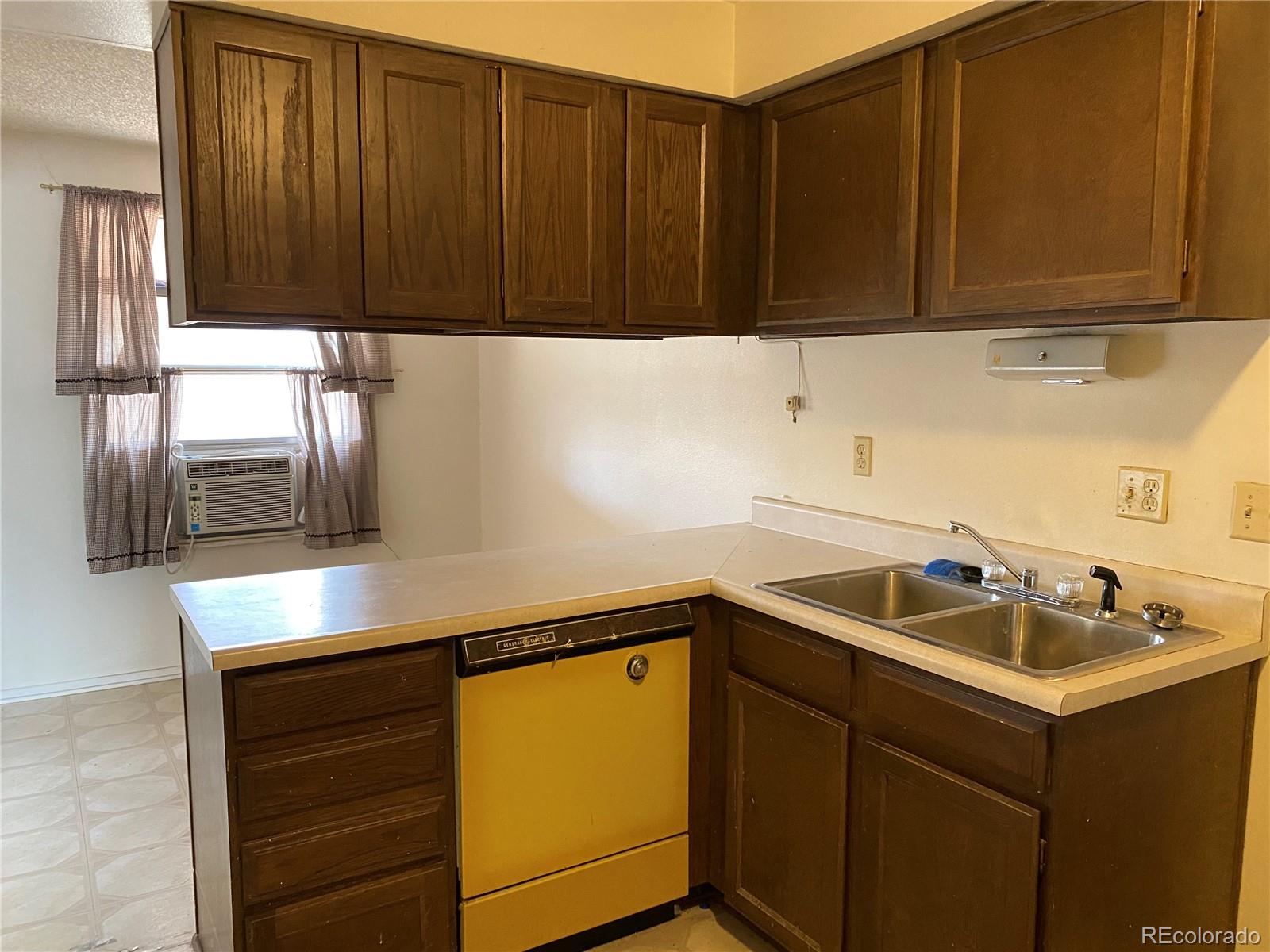 1165 Alter Way Broomfield, CO 80020 - Photo 6 of 31 a kitchen with a sink and cabinets