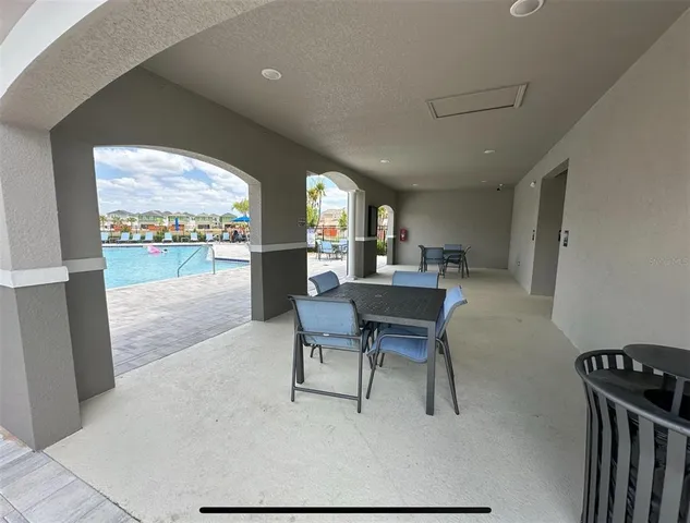 a open kitchen with a table and chairs