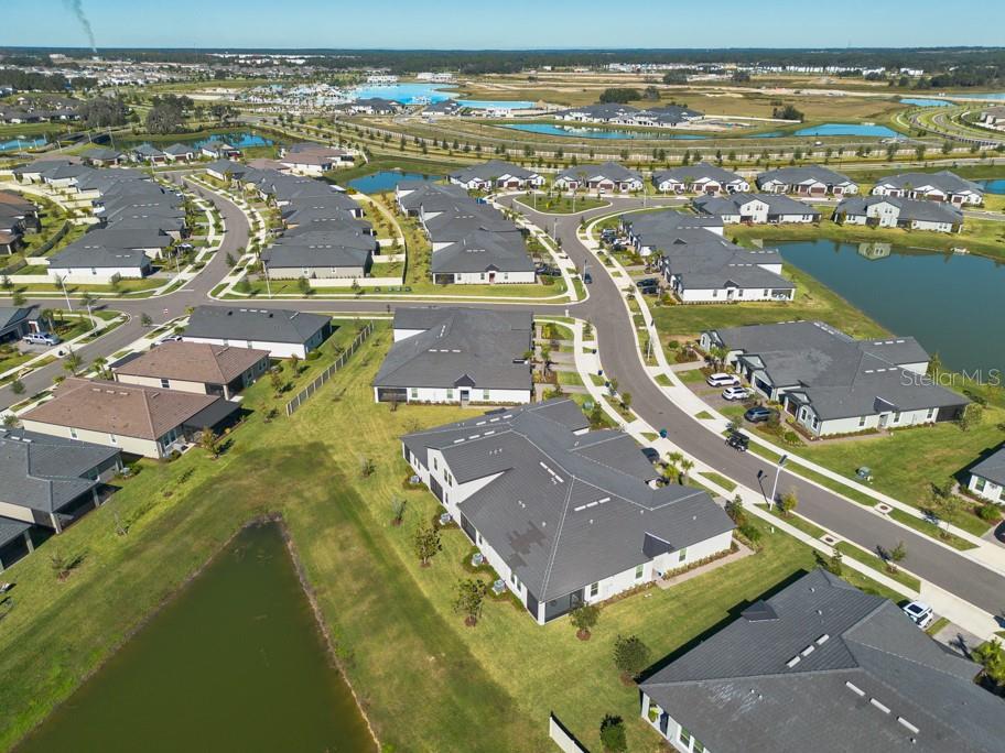 10976 Gable Dig Loop San Antonio, FL 33576 - Photo 32 of 37 an aerial view of residential houses with outdoor space
