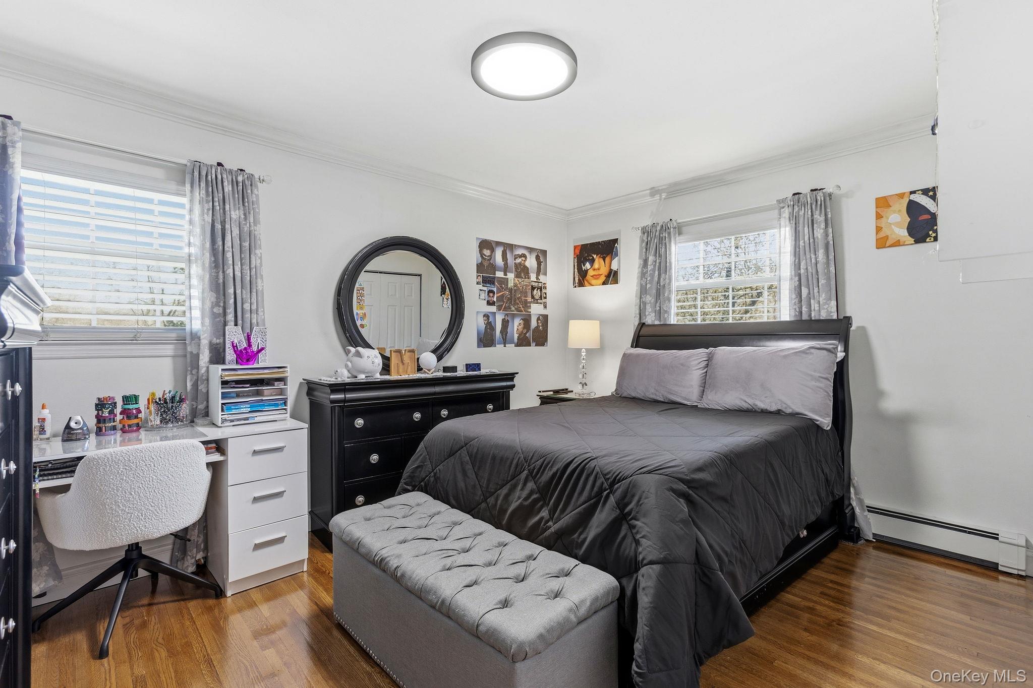 56 Tanager Road Mahopac, NY 10541 - Photo 16 of 30 a bedroom with a bed and a dresser with mirror