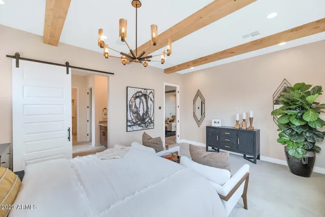 a en suite bathroom with double vanity and a mirror
