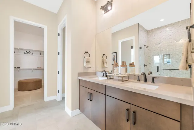 a bedroom with a large bed and a large window