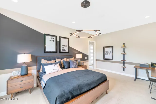 a bathroom with a granite countertop bathtub sink vanity mirror and toilet