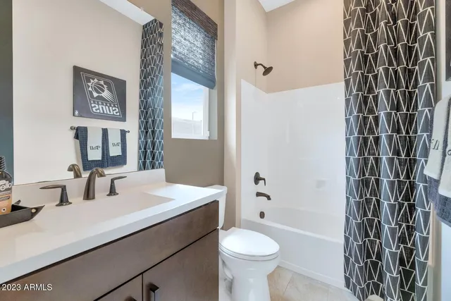 a outdoor living space with furniture potted plant and a floor to ceiling window