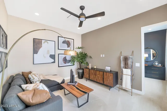 a view of a patio with couches table and chairs and potted plants