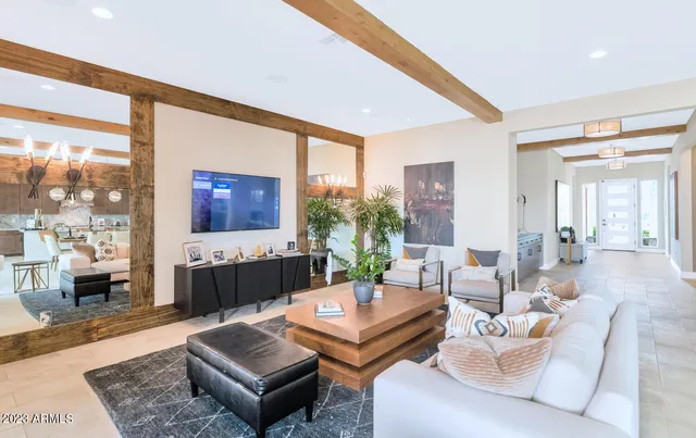 a kitchen with a dining table chairs sink and stove