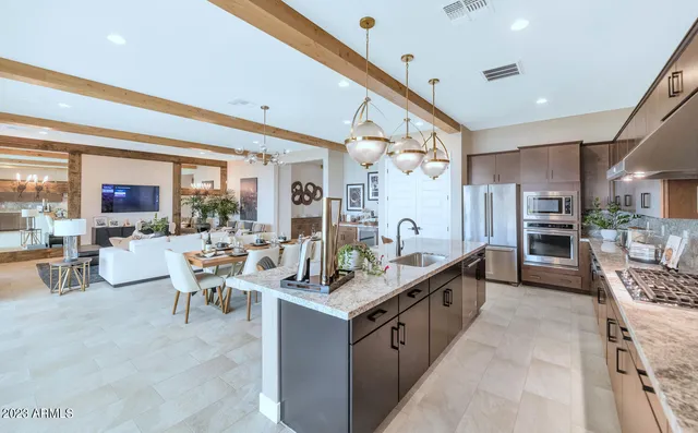 a bathroom with a granite countertop sink a mirror and a shower