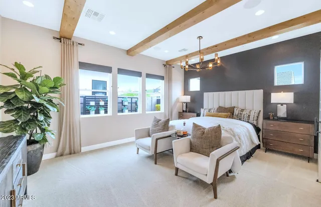 a living room with furniture and a lamp