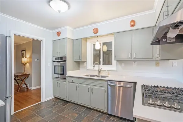 a kitchen with cabinets and window