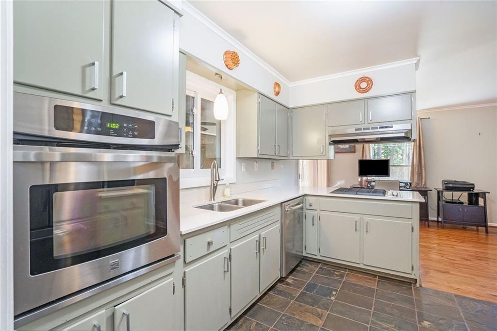 1220 Blueberry Trail Decatur, GA 30033 - Photo 12 of 30 a kitchen with stainless steel appliances granite countertop a stove and a sink