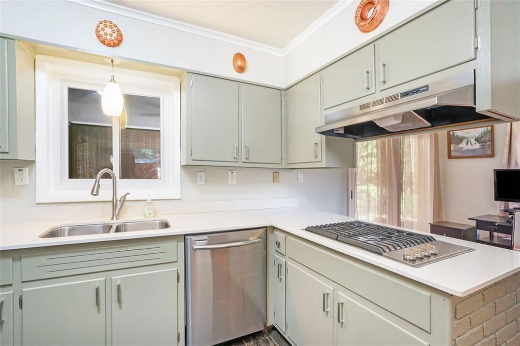 1220 Blueberry Trail Decatur, GA 30033 - Photo 14 of 30 a kitchen with stainless steel appliances granite countertop a sink and a stove
