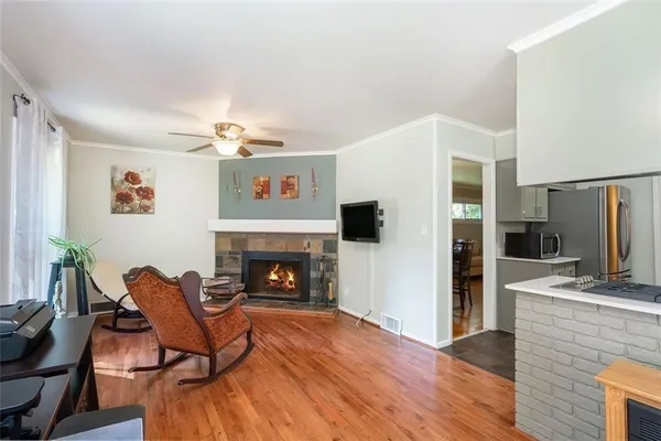 a living room with furniture and a fireplace