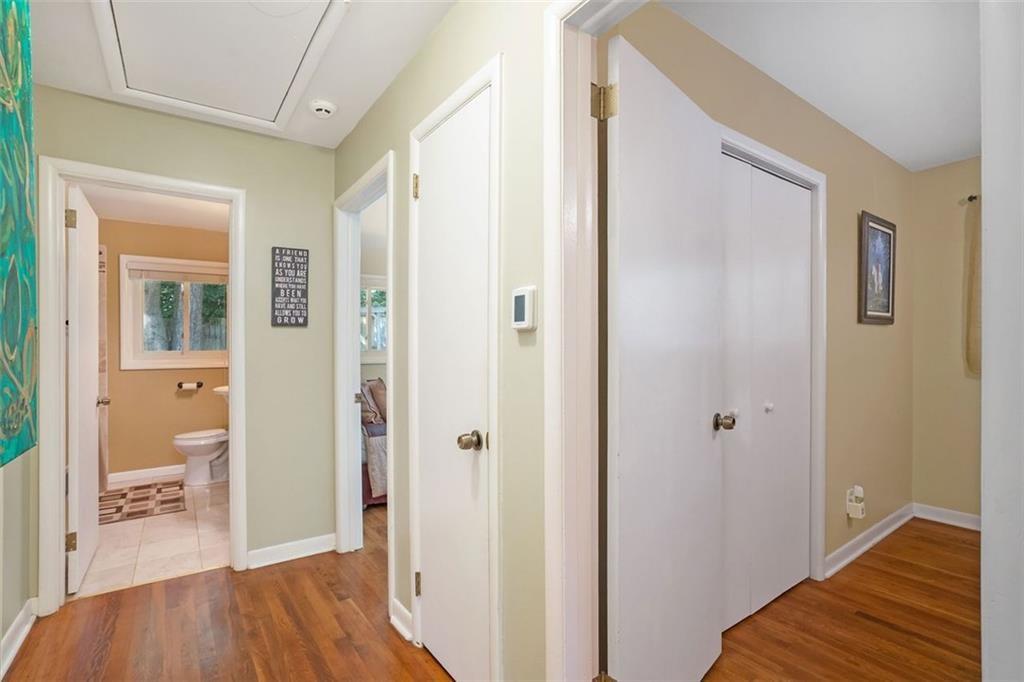1220 Blueberry Trail Decatur, GA 30033 - Photo 18 of 30 a view of a hallway with bathroom and wooden floor