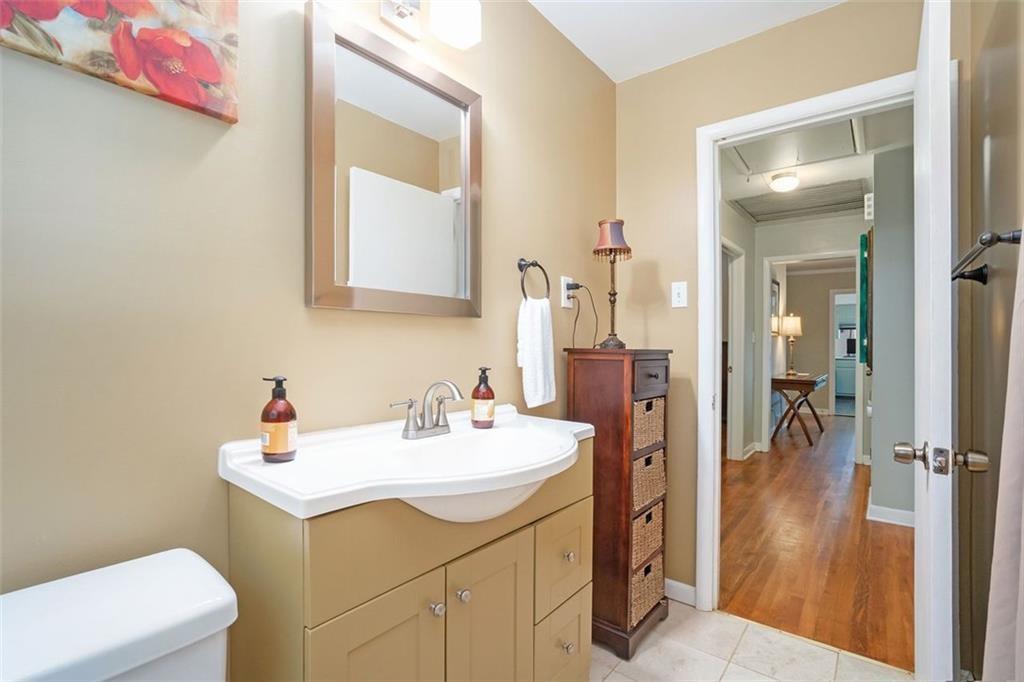 1220 Blueberry Trail Decatur, GA 30033 - Photo 23 of 30 a bathroom with a sink a toilet and a mirror