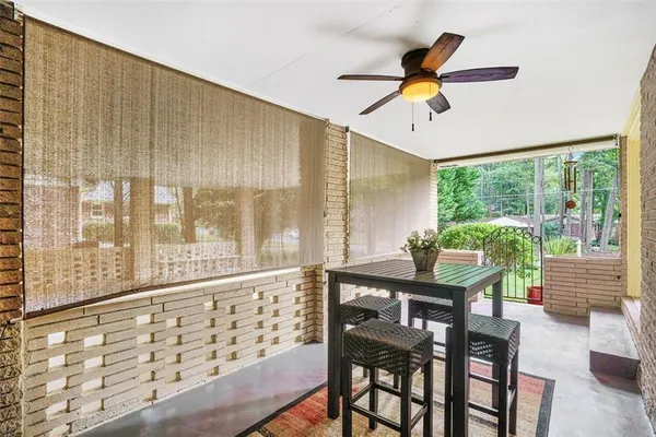 a view of a dining room with furniture window and outside view