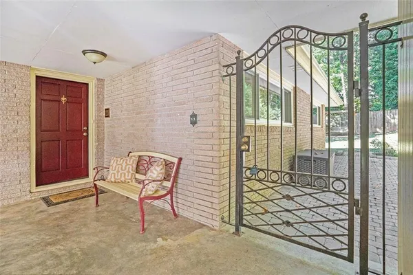 a view of a brick house with a bench and bench