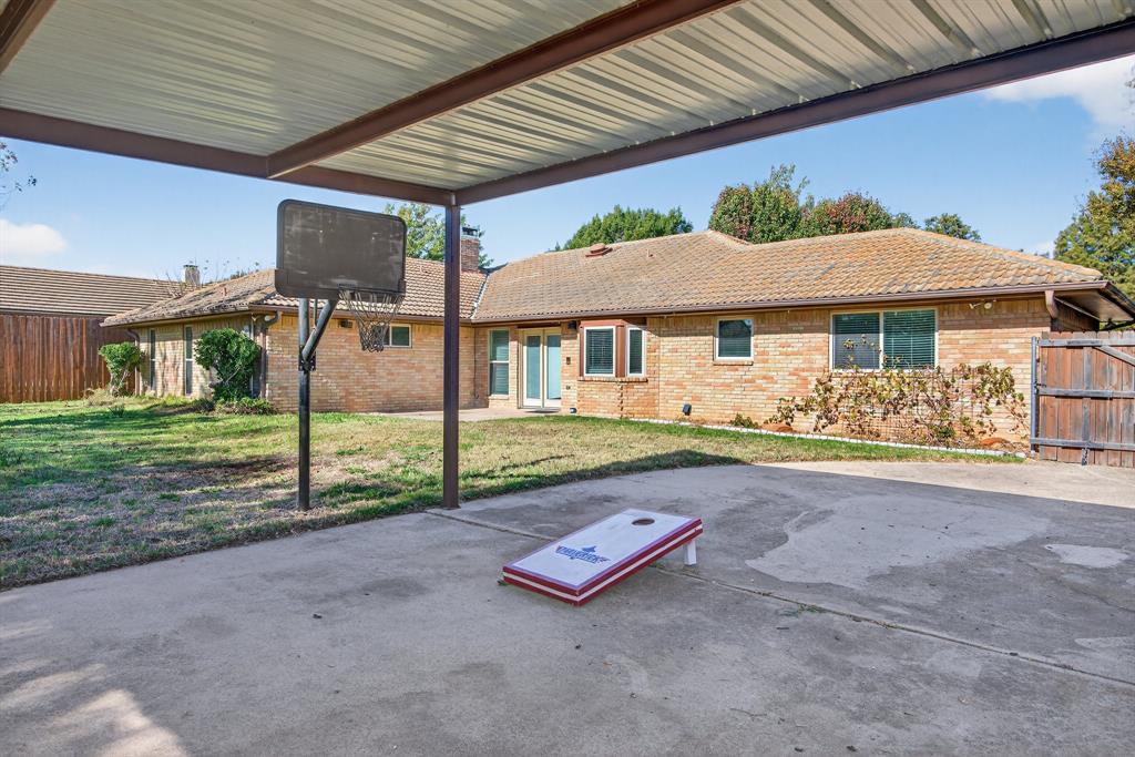 1128 Sunset Drive Trophy Club, TX 76262 - Photo 25 of 30 a front view of a house with porch