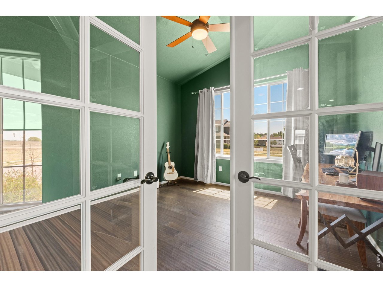 8847 16th St Road Greeley, CO 80634 - Photo 31 of 38 a view of an entryway with wooden floor