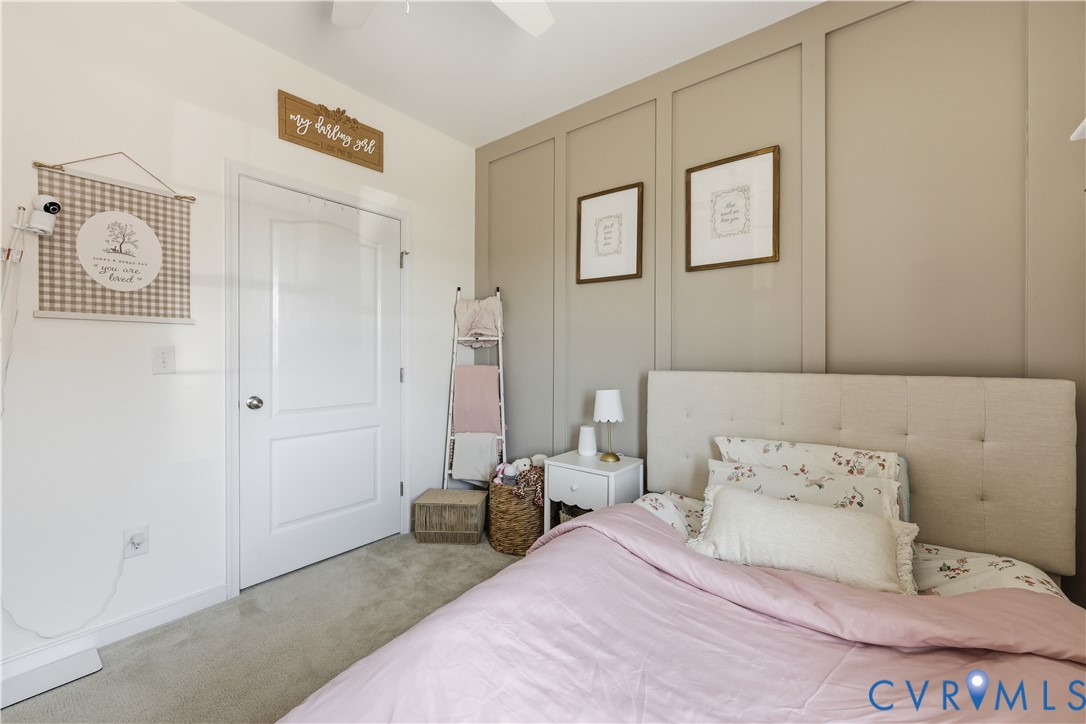 235 Stoney Point Road Cumberland, VA 23040 - Photo 34 of 35 a bedroom with a bed and painting on the wall