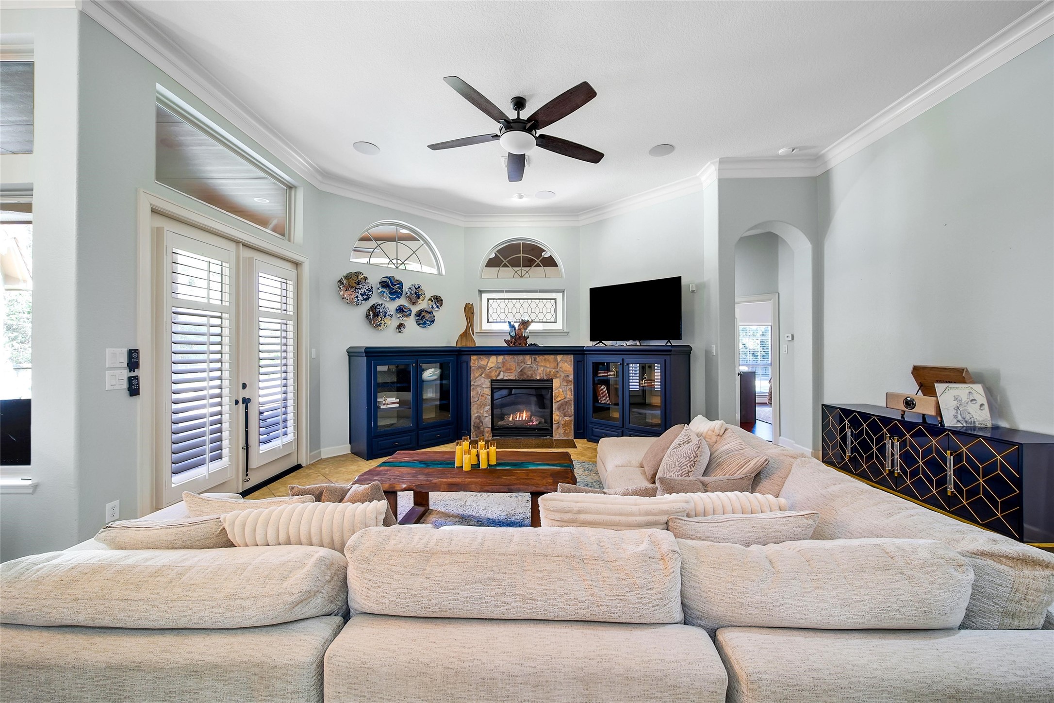 26122 Crown Ranch Boulevard Montgomery, TX 77316 - Photo 11 of 31 a living room with fireplace furniture and a flat screen tv