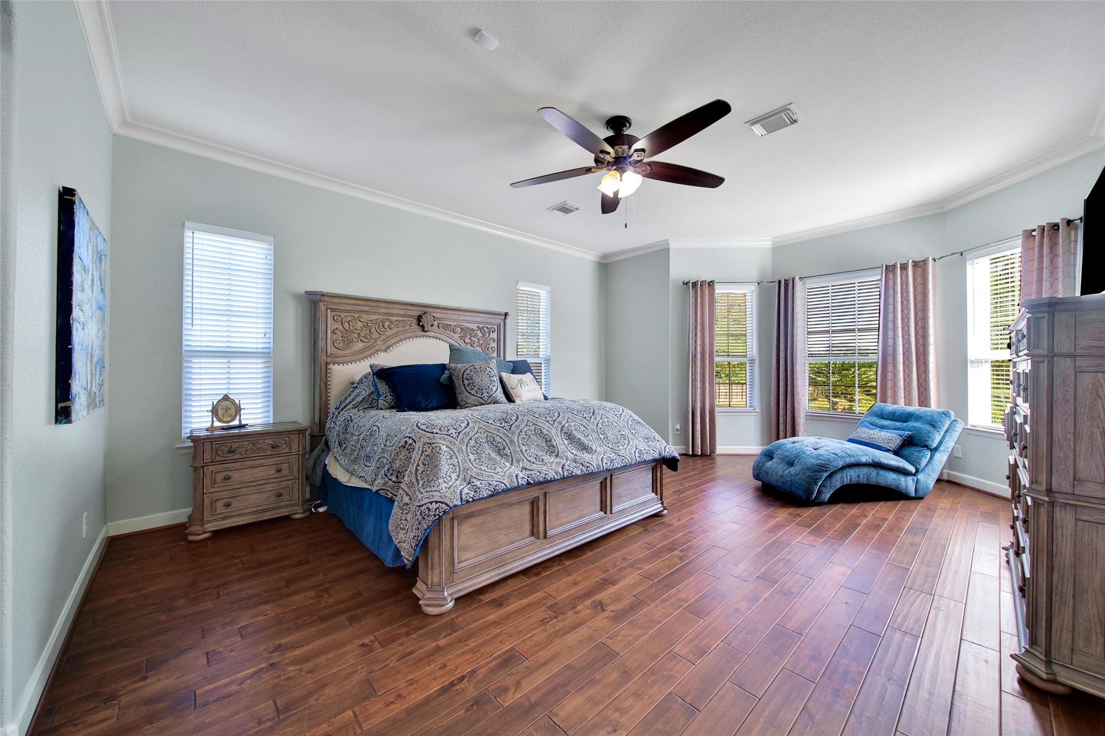 26122 Crown Ranch Boulevard Montgomery, TX 77316 - Photo 13 of 31 a bedroom with a bed a couch and a window