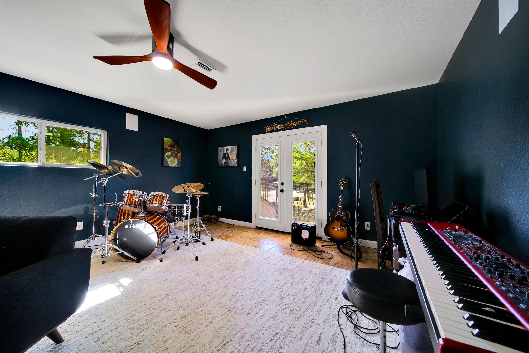 26122 Crown Ranch Boulevard Montgomery, TX 77316 - Photo 23 of 31 a room with gym equipment and a flat screen tv