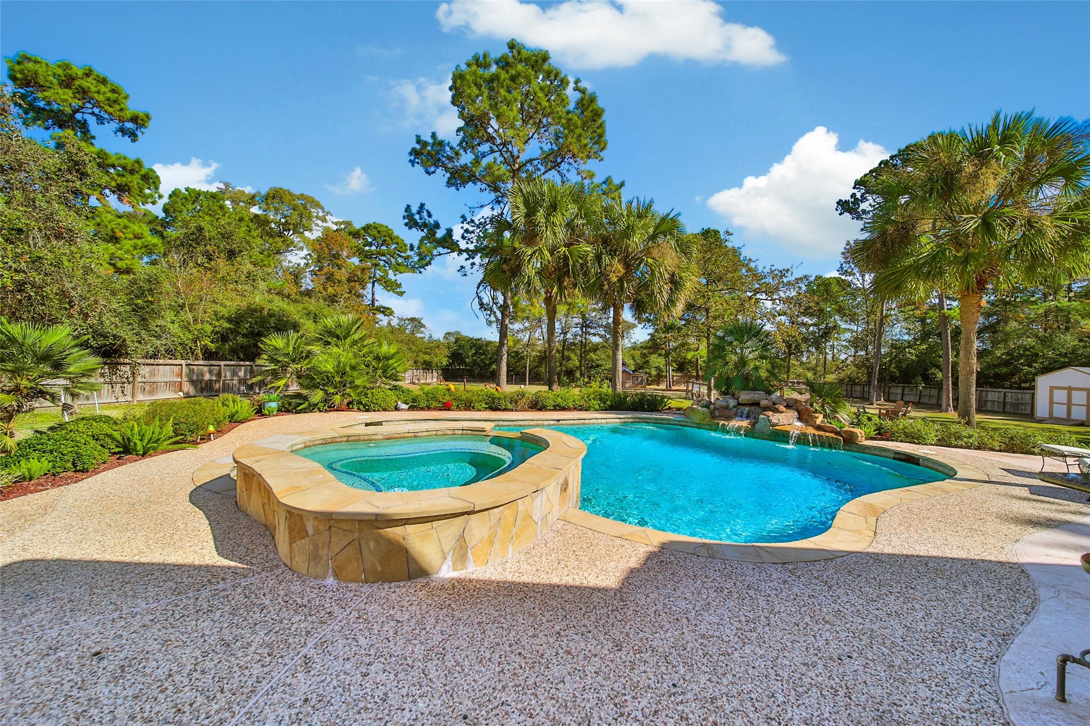 26122 Crown Ranch Boulevard Montgomery, TX 77316 - Photo 27 of 31 a view of a backyard with swimming pool